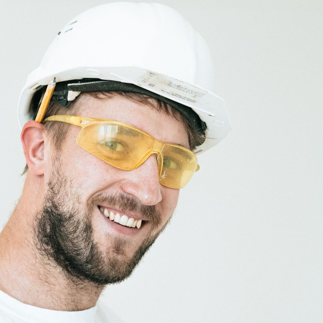Illustrative stock portrait of Dale Tuten, the fictional roofer behind Tuten & Padgett Roofing